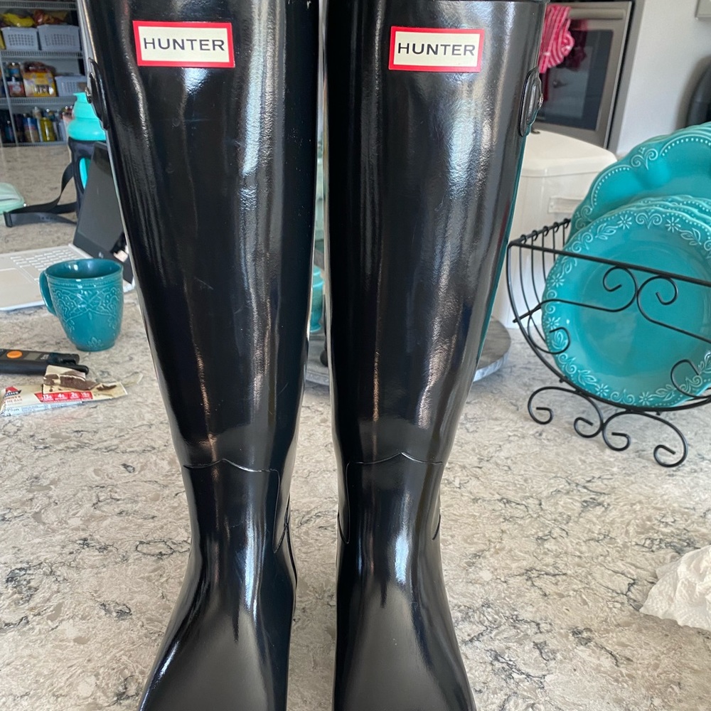 Black tall hunter boots